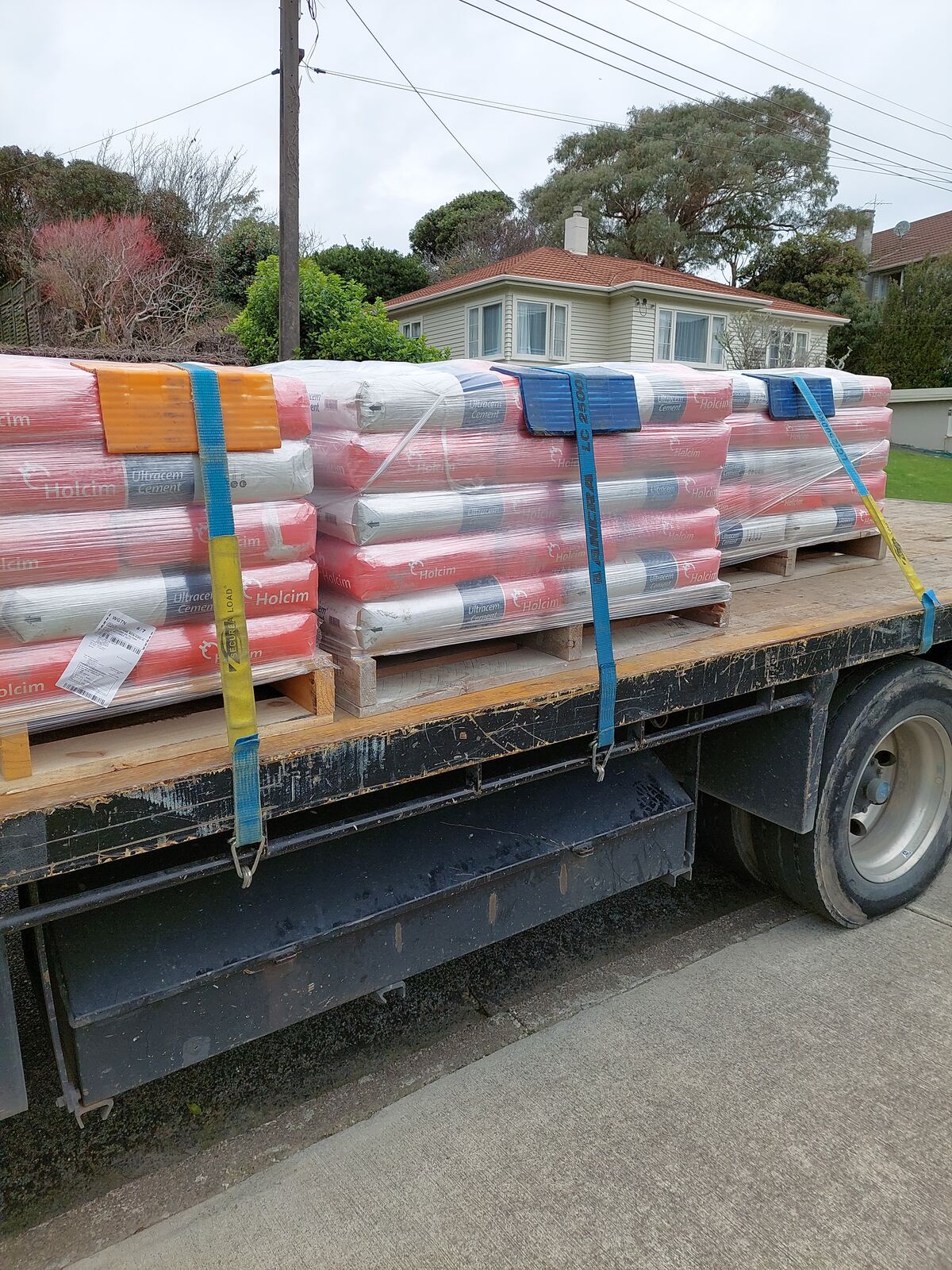Building material delivery Wellington - cement strapped down on CDT's flatbed